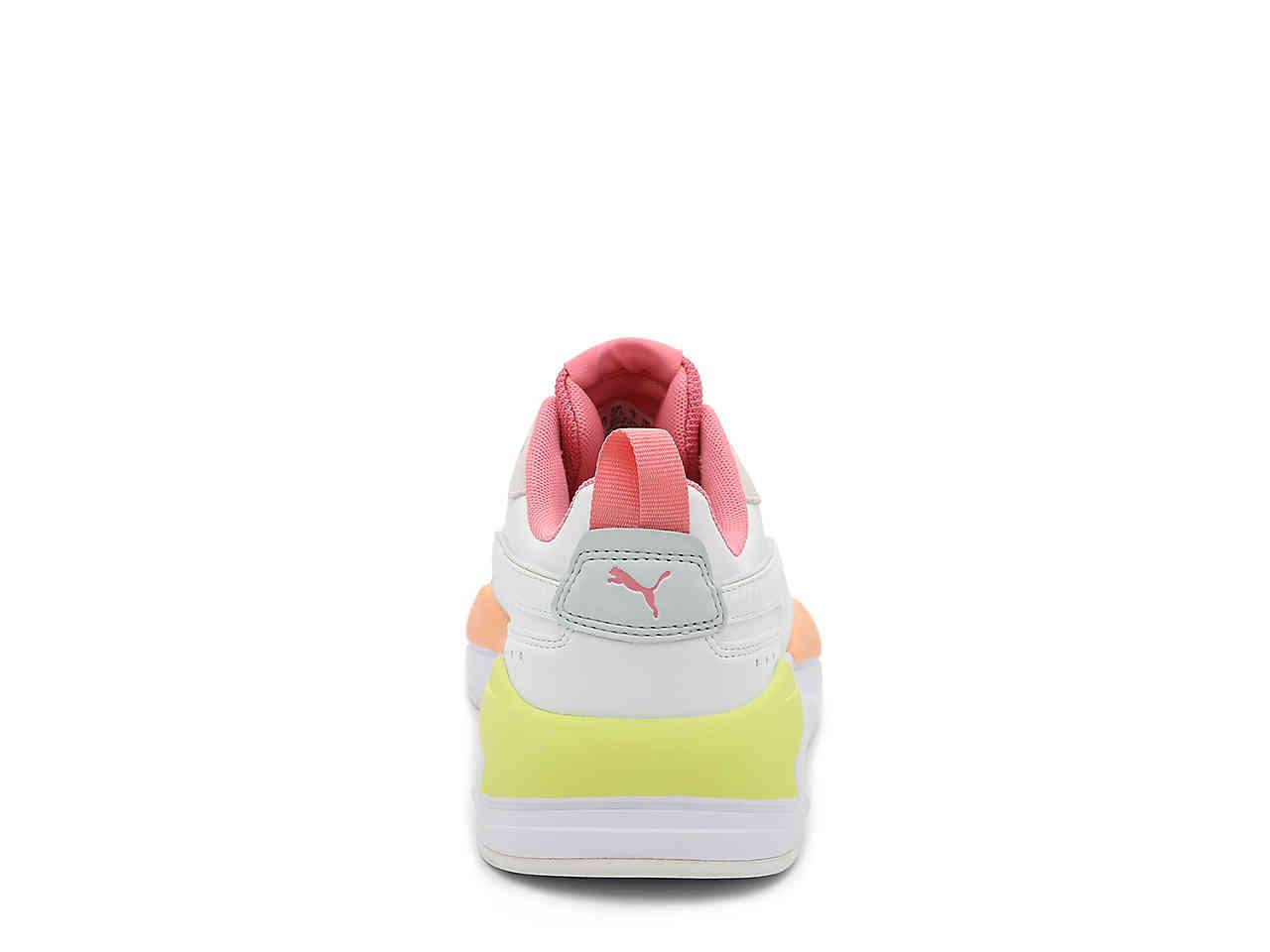 lime green and pink pumas