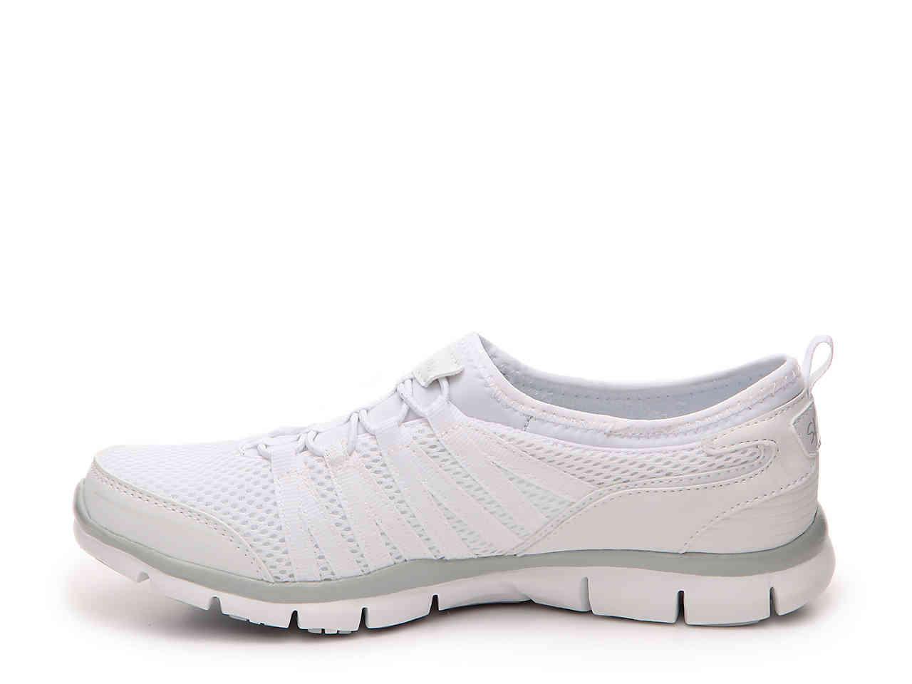 white skechers slip on trainers
