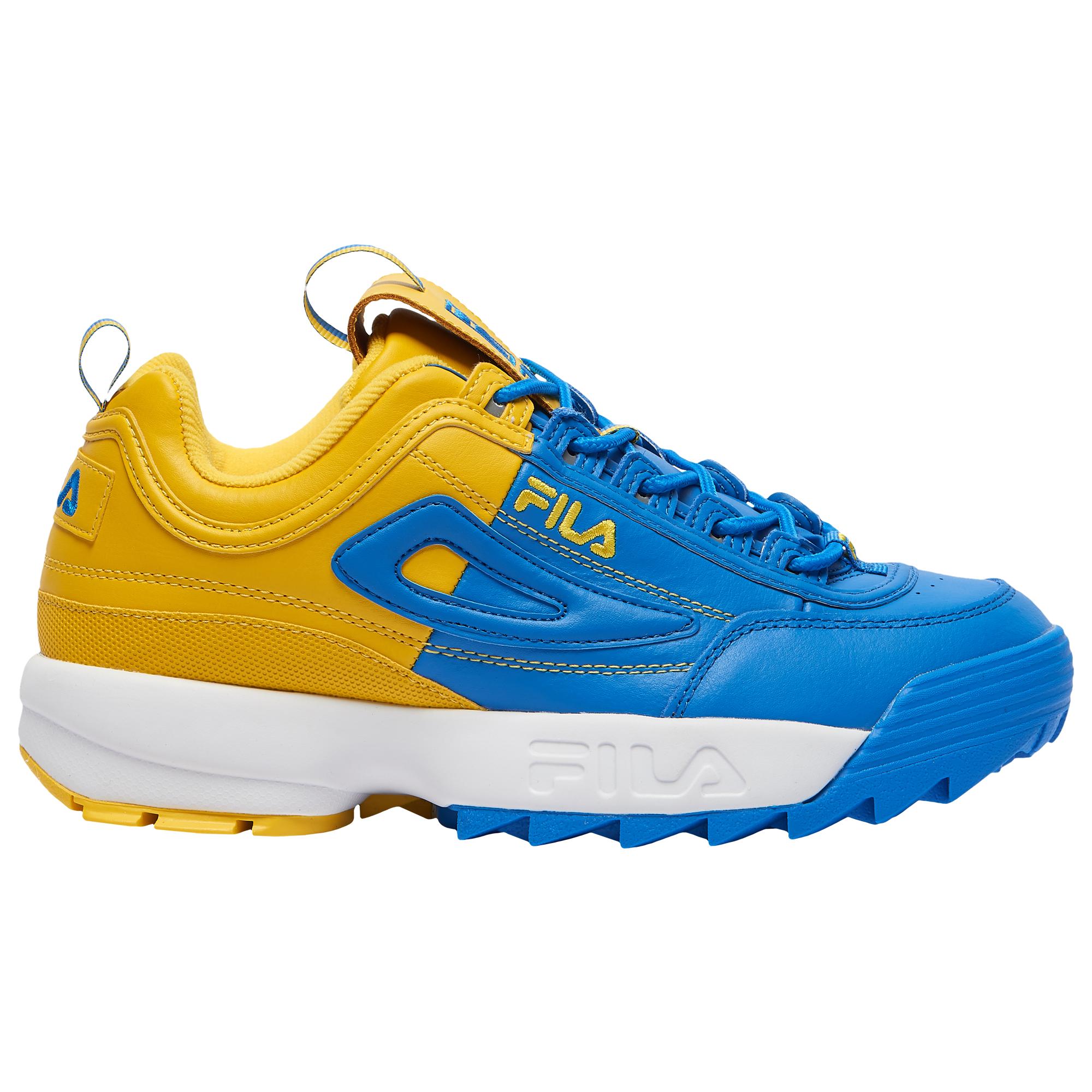 blue and yellow fila shoes