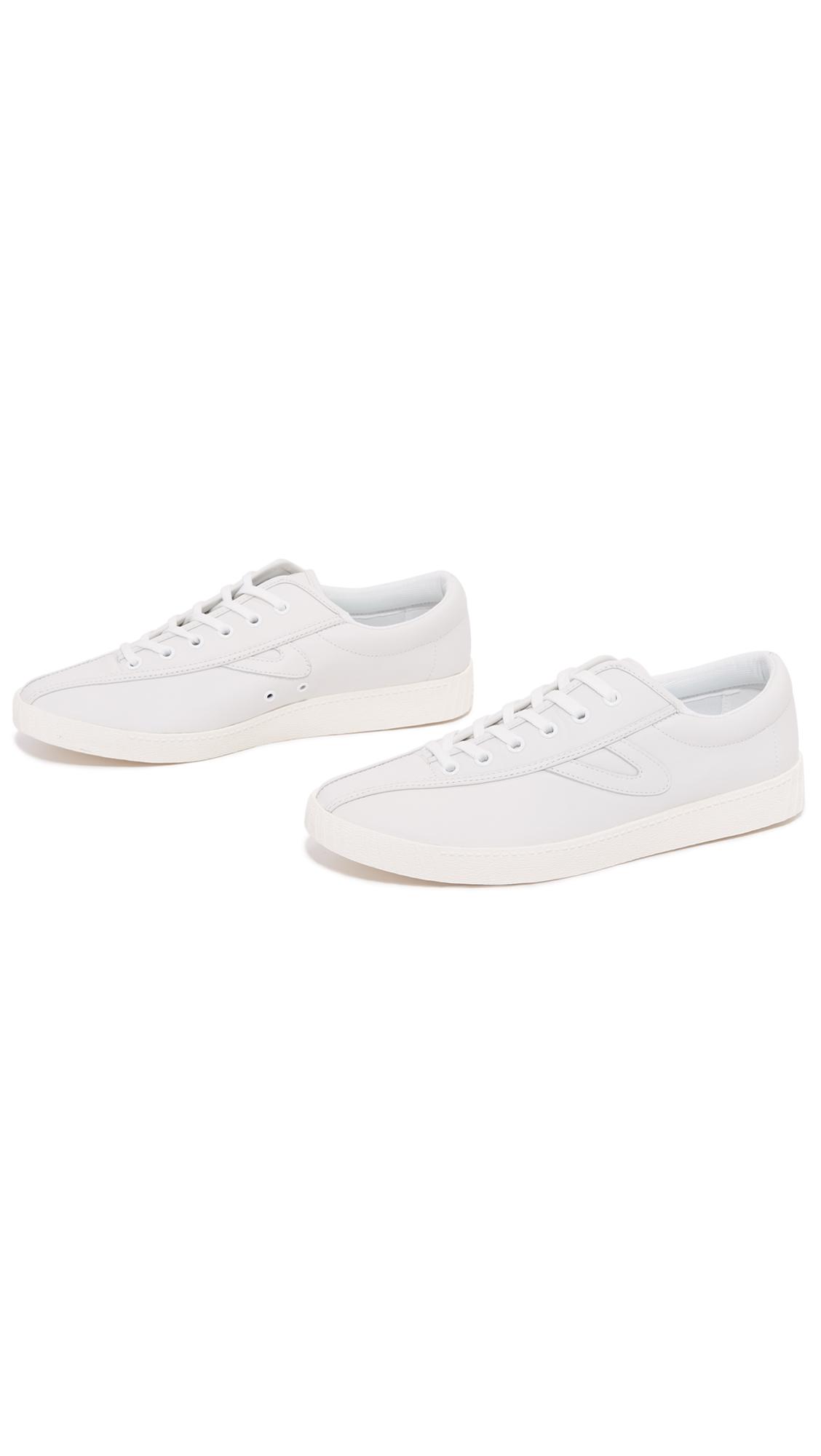 white leather tretorns