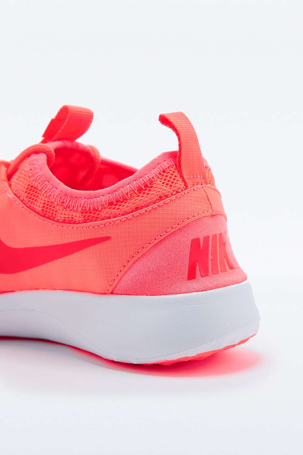 coral nike trainers