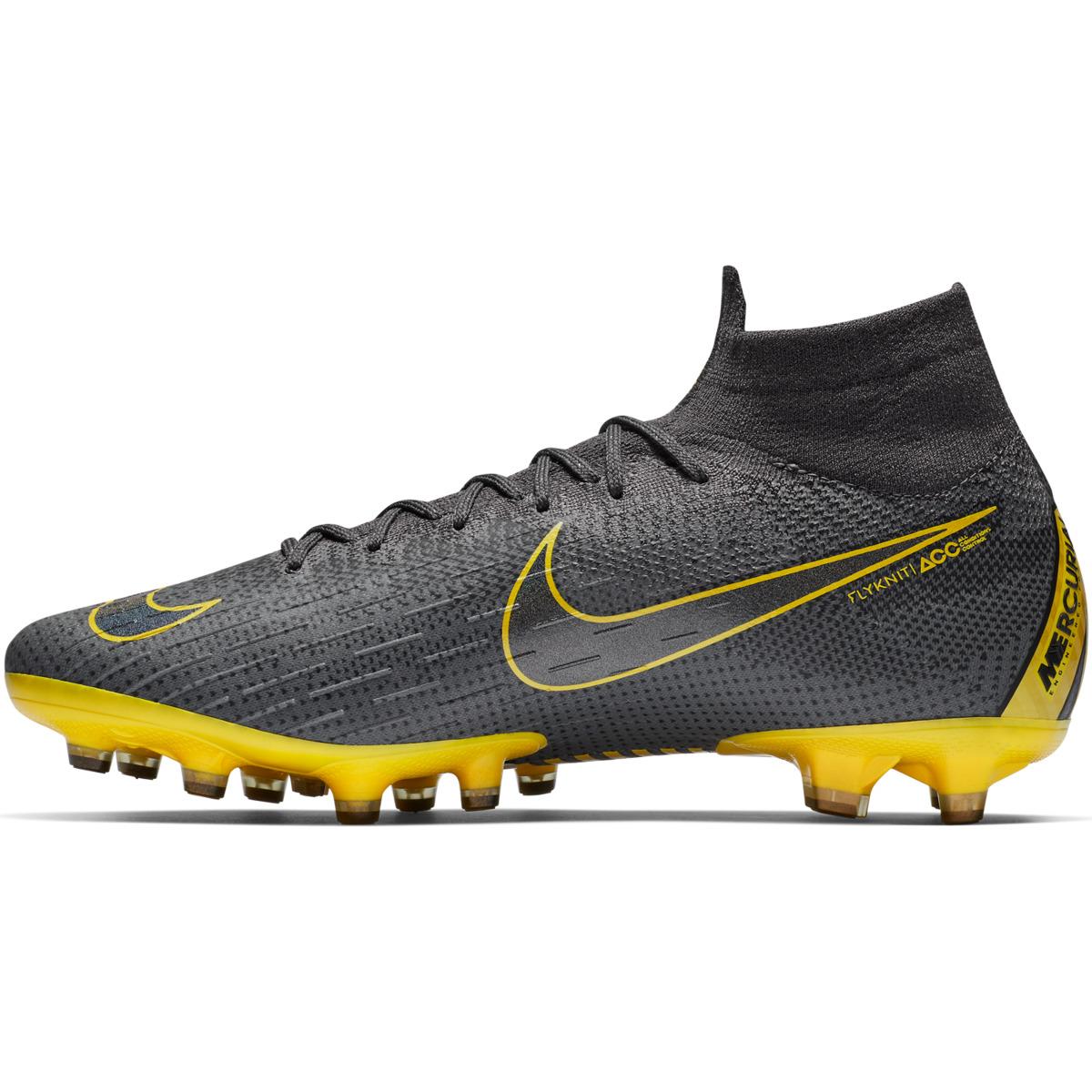 grey and yellow nike boots
