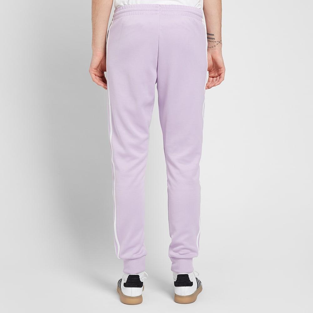 adidas sst track pants purple
