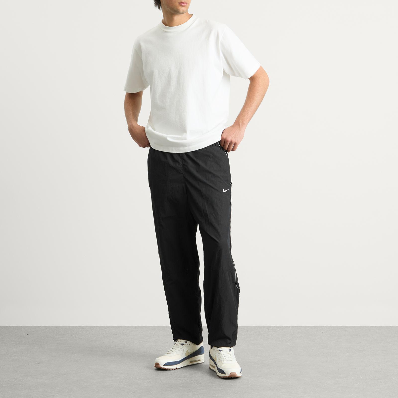 Nike Solo Swoosh Woven Track Pant in Black for Men | Lyst UK