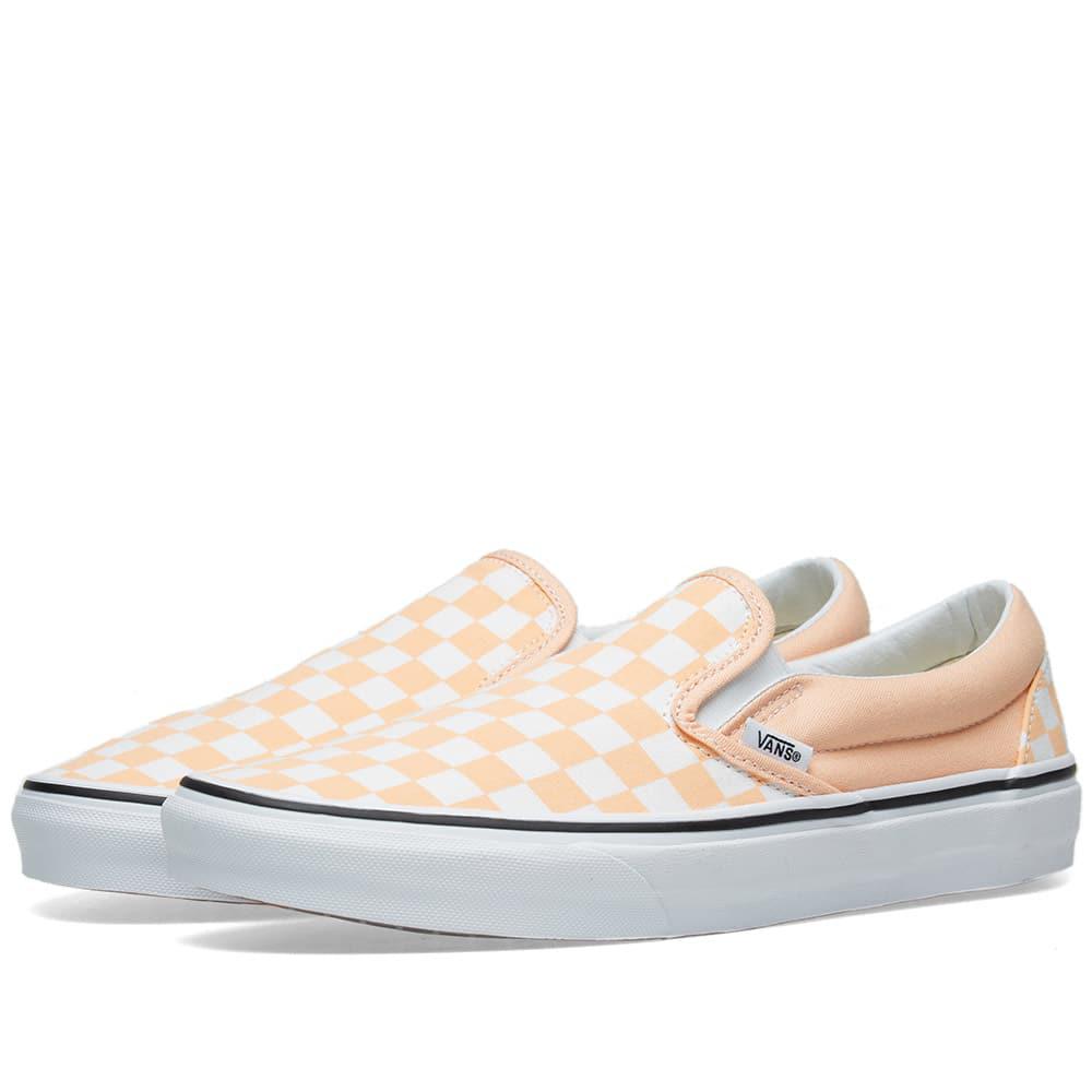 orange checkerboard slip on vans