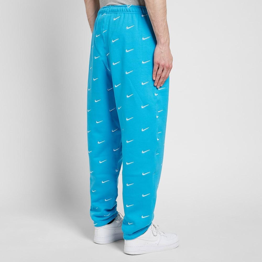 nike swoosh logo trousers