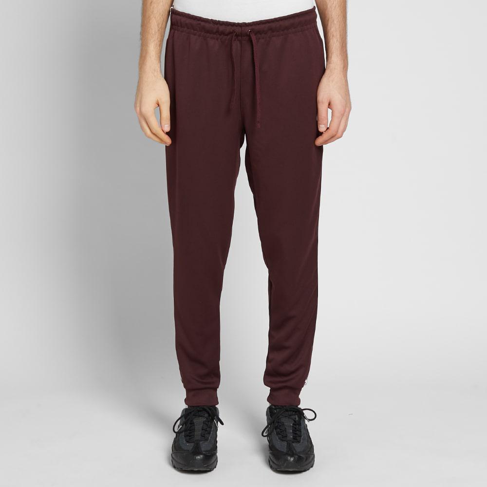 nike repeat poly pants