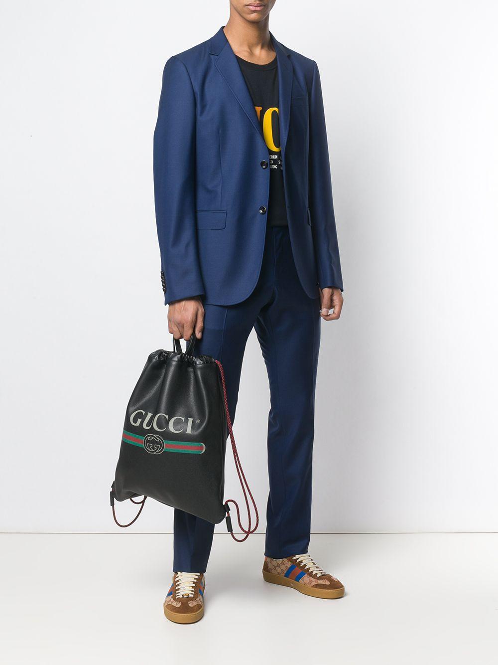 gucci print leather drawstring backpack