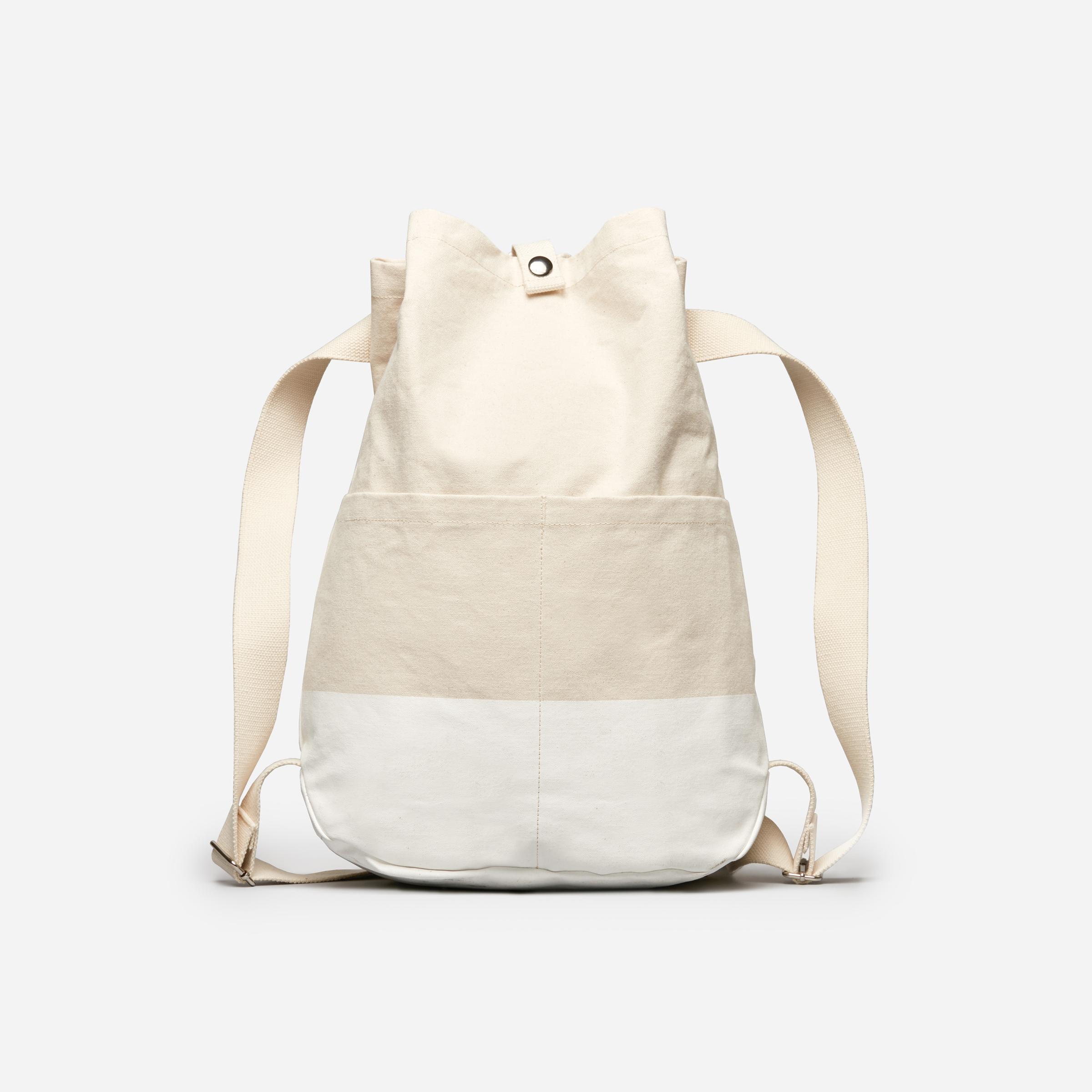 white canvas backpack