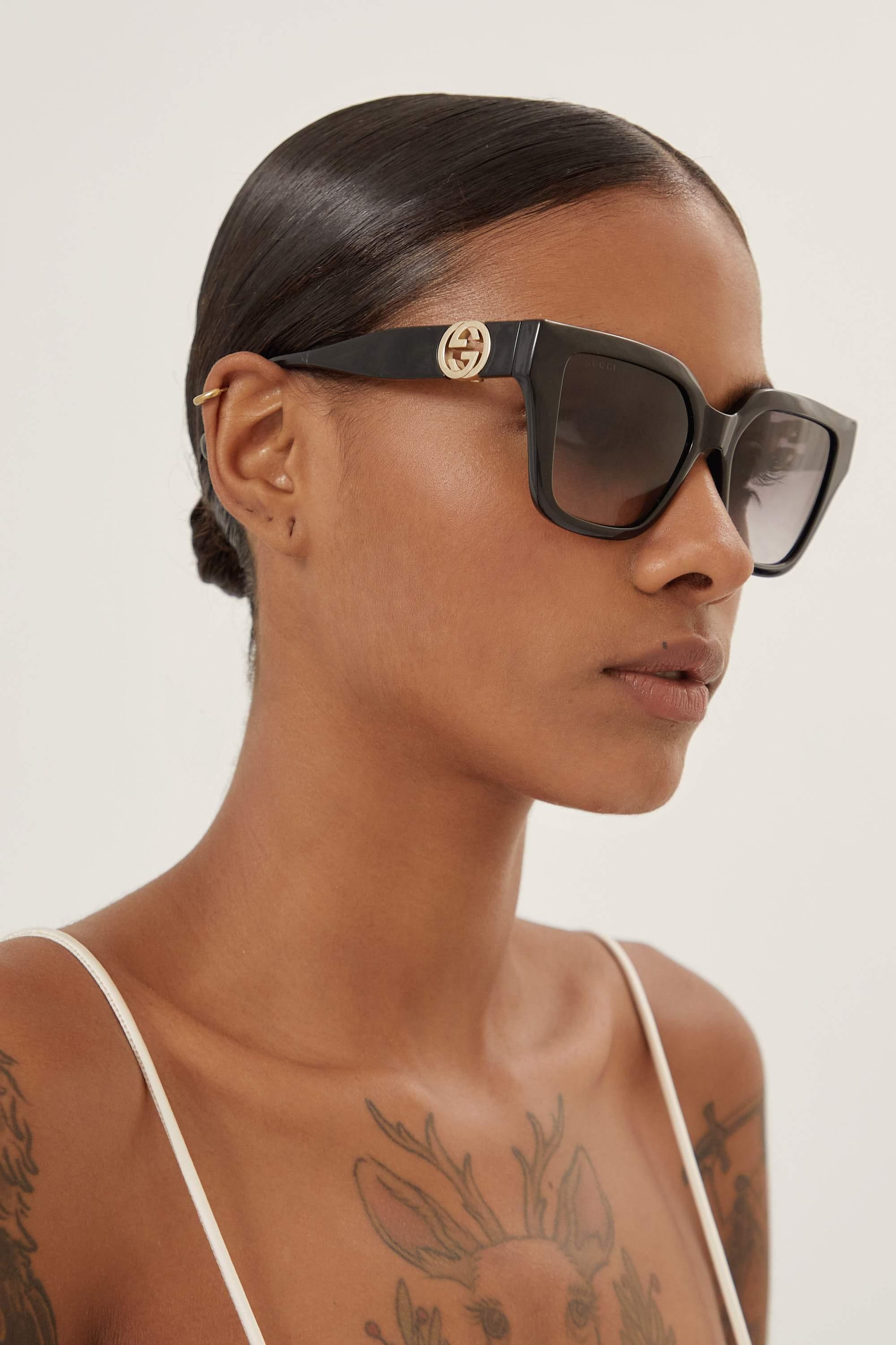 Gucci Cat-eye Black Sunglasses With Integrated GG Logo in Brown | Lyst