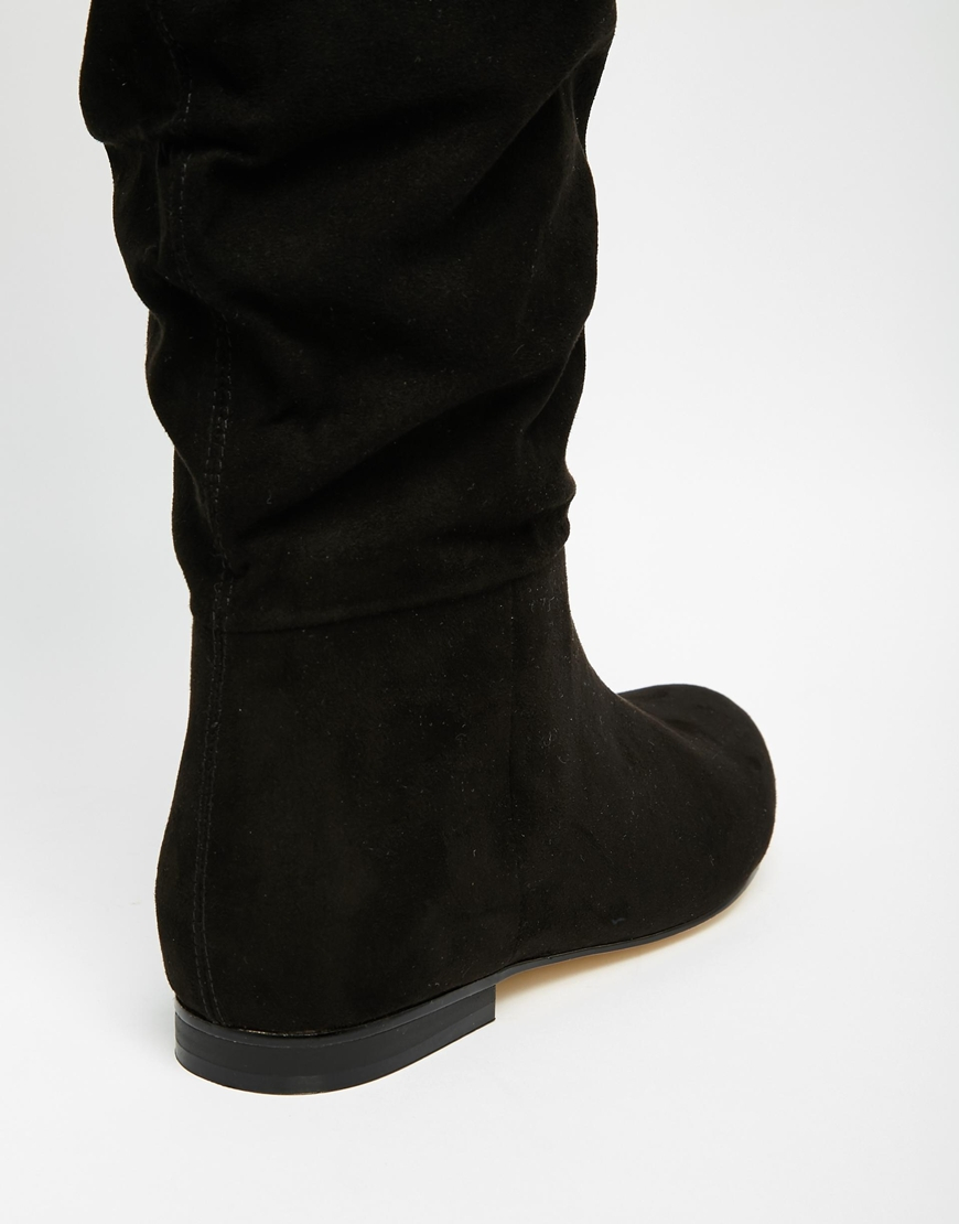 ASOS Collaborate Knee High Flat Slouch Boots in Black - Lyst