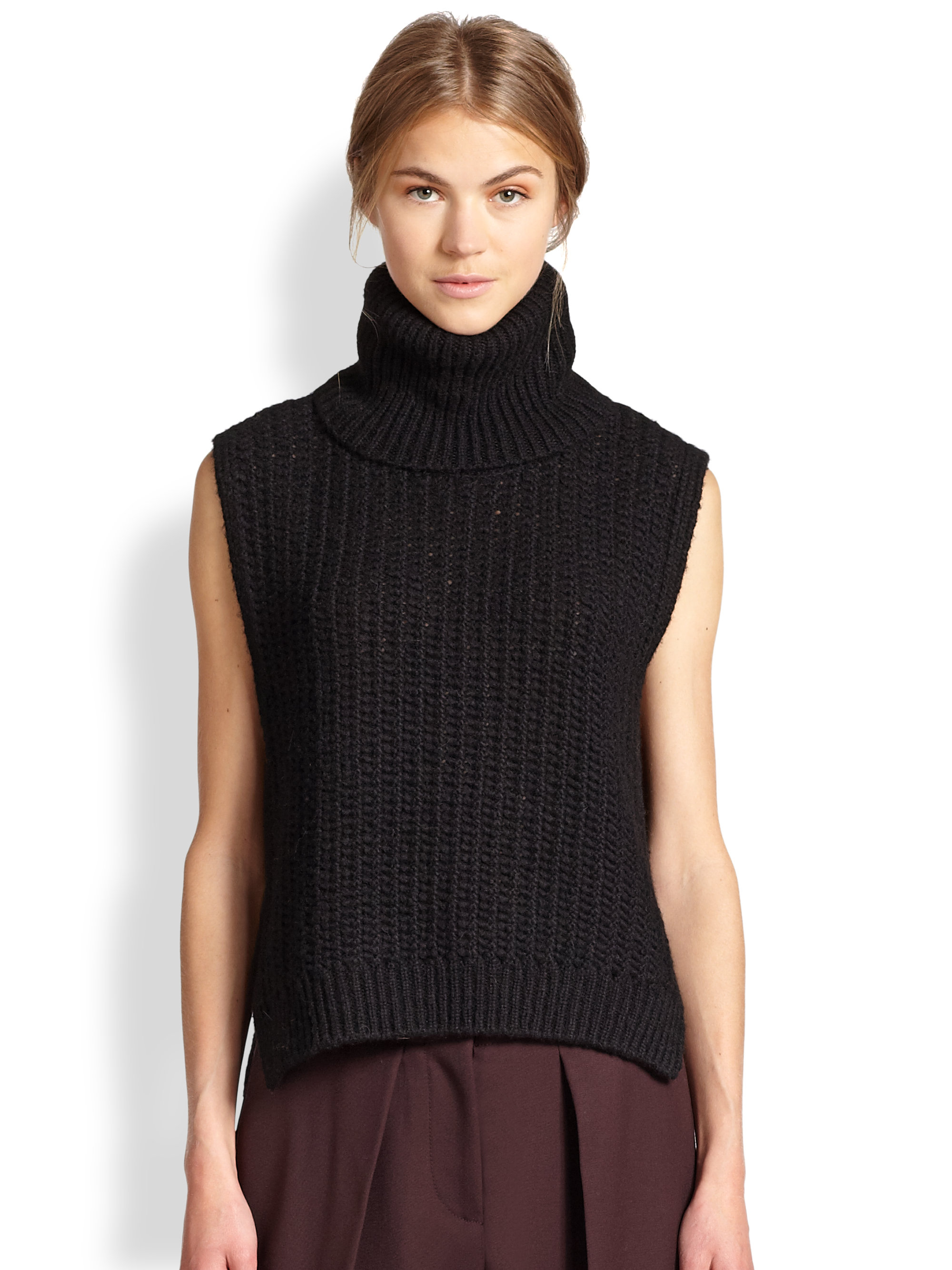 black turtleneck sleeveless sweater