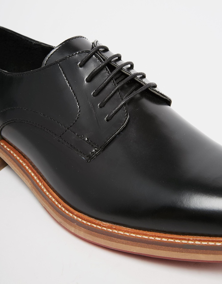 black formal shoes with brown sole