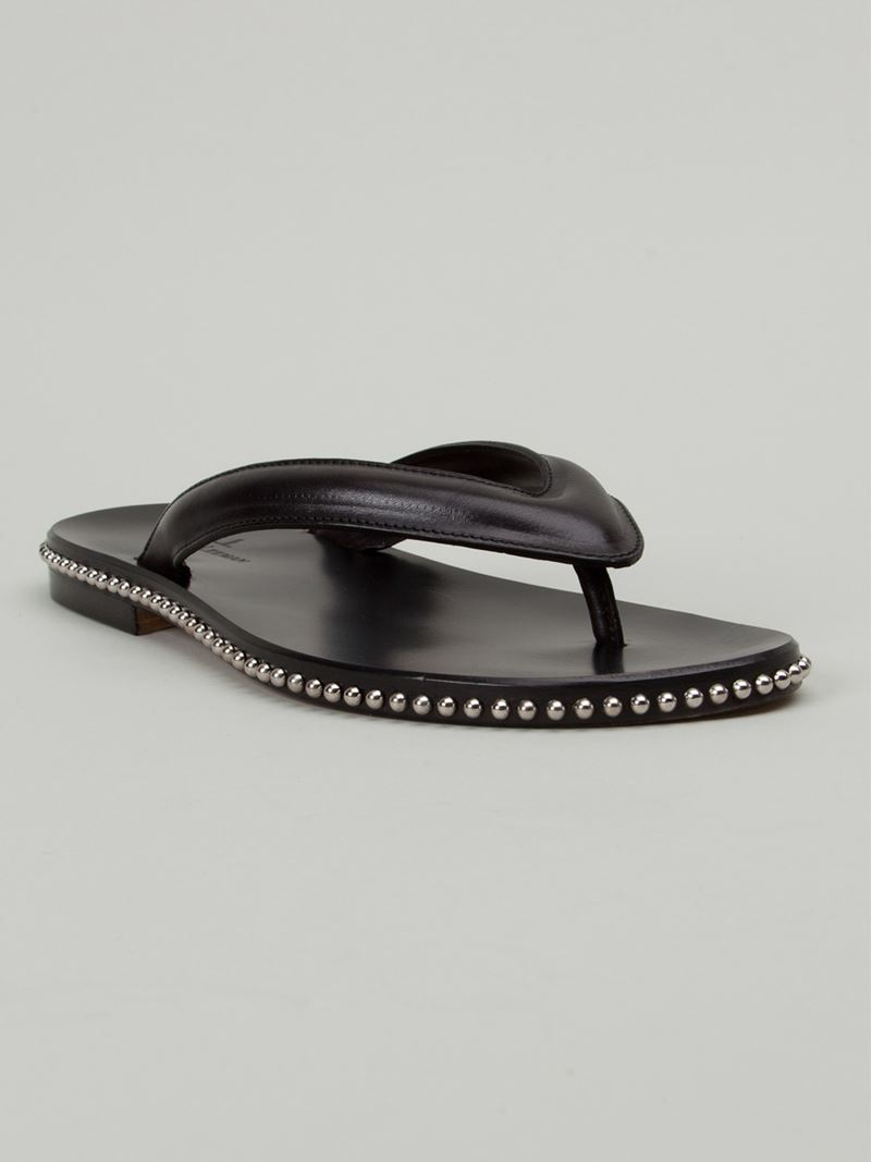 black studded flip flops