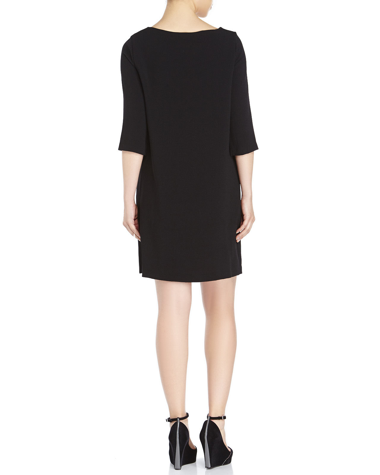 Narrow Choices Stitching along the sides subtly defines the body of this effortless shift dress, while an inverted pleat down the center accentuates its elegant drape. Relaxed fit. Intended to hit at the knee.