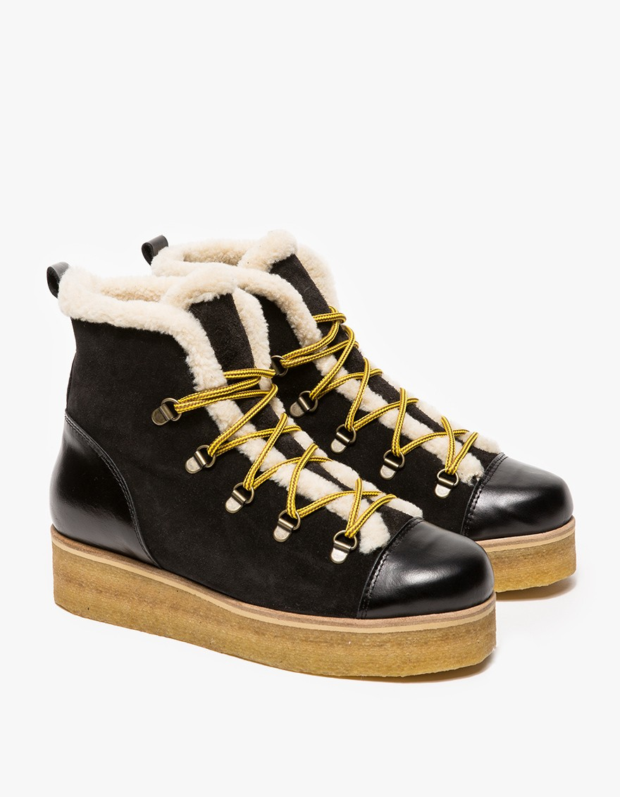 black ankle boots with white fur