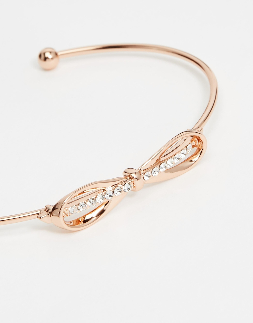 Lyst Ted Baker Sorina Sleek Bow Ultra Fine Cuff Bracelet In Metallic Gallery