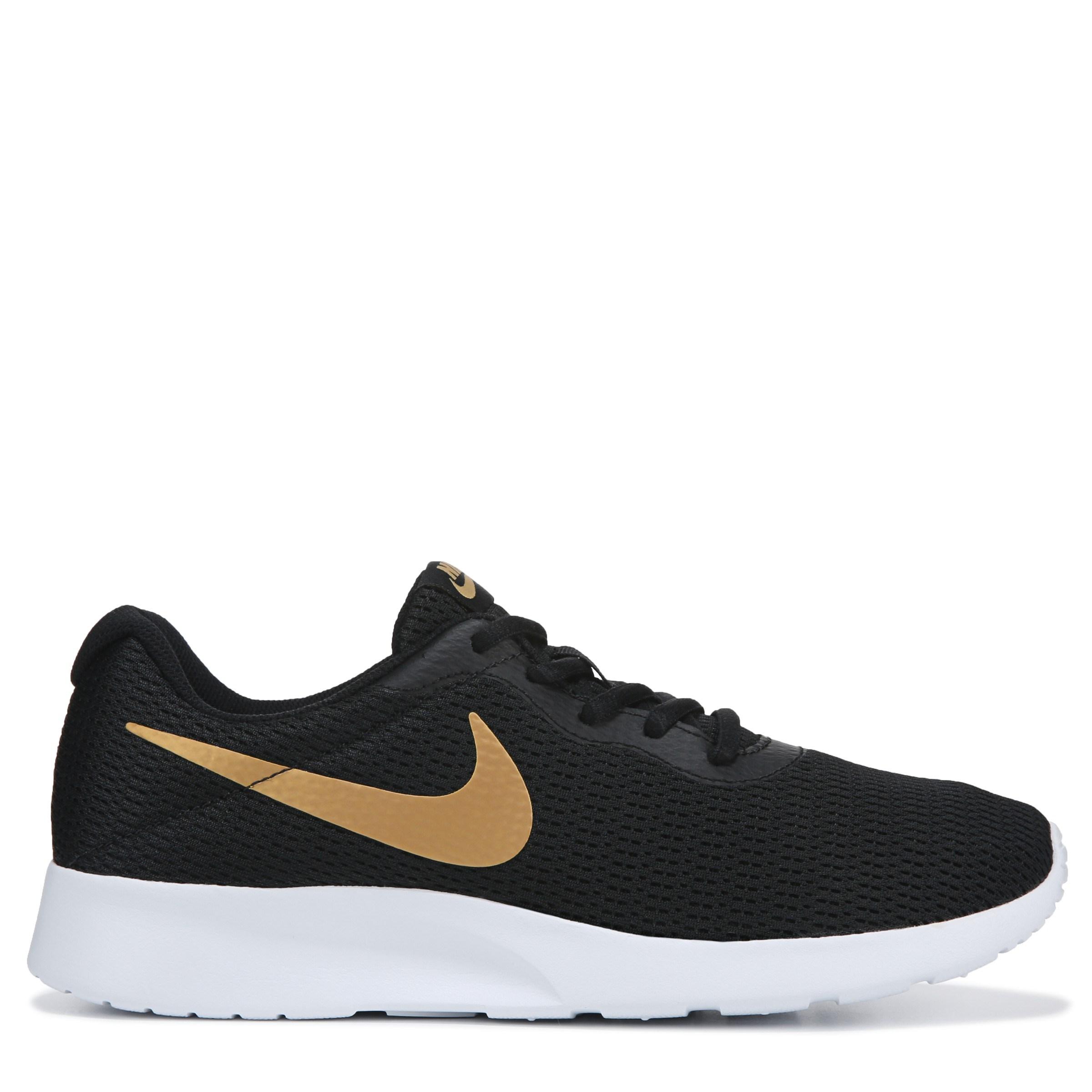 black and gold nike tanjun