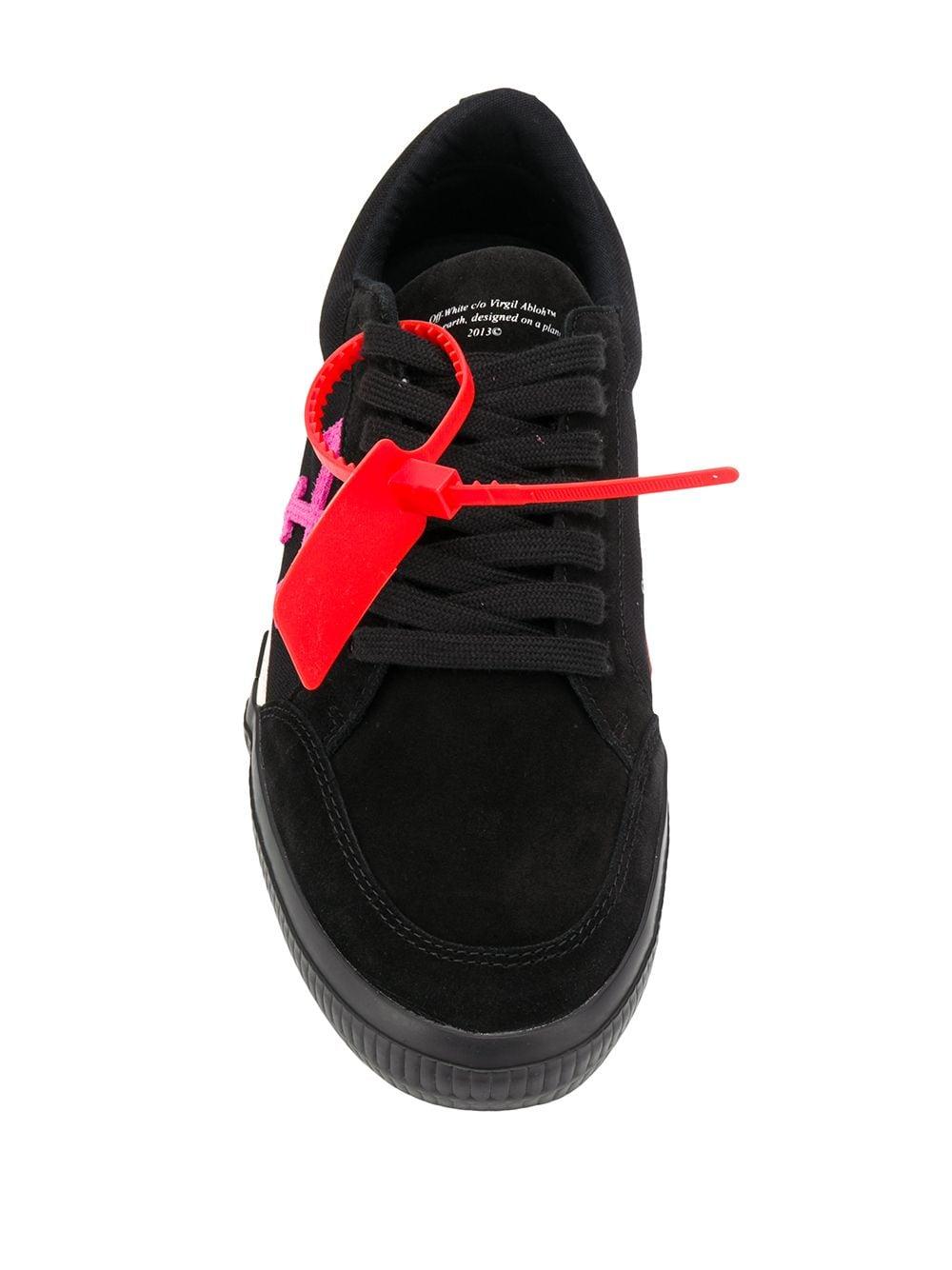 sneakers with arrow logo