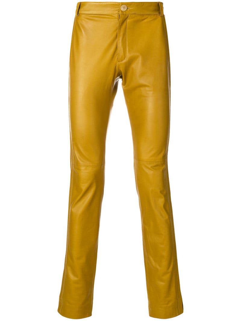 yellow leather trousers