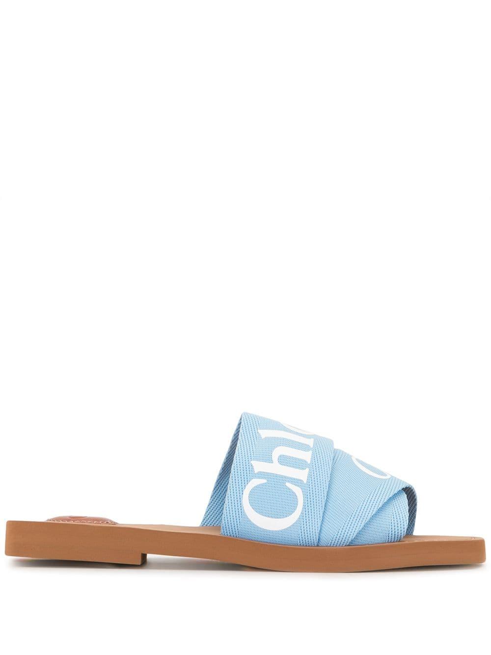 Chloé Baumwolle 'Woody' Sandalen mit Logo-Riemen in Blau - Lyst