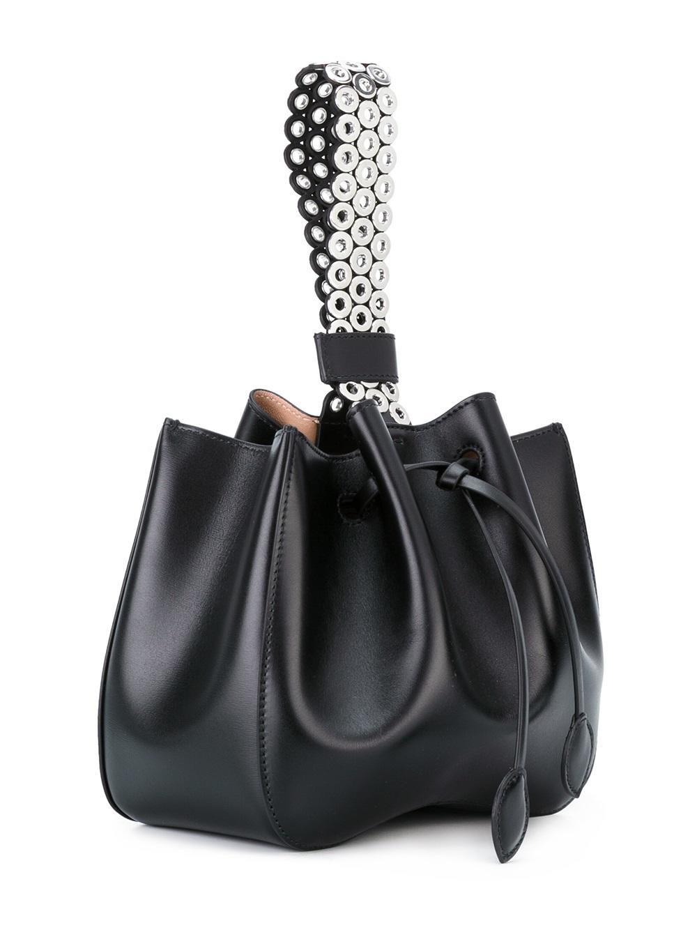 Lyst - Alaïa Eyelet Studded Wristlet Bag in Black