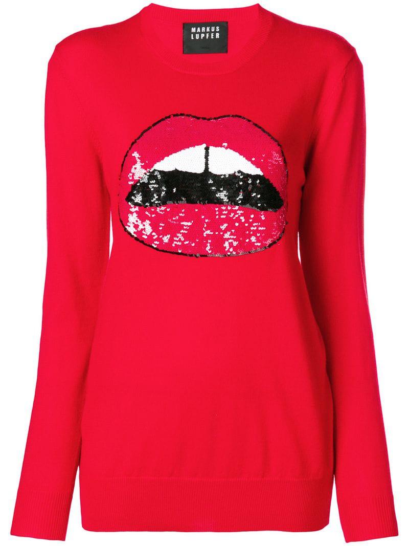 red jumper with sequin lips