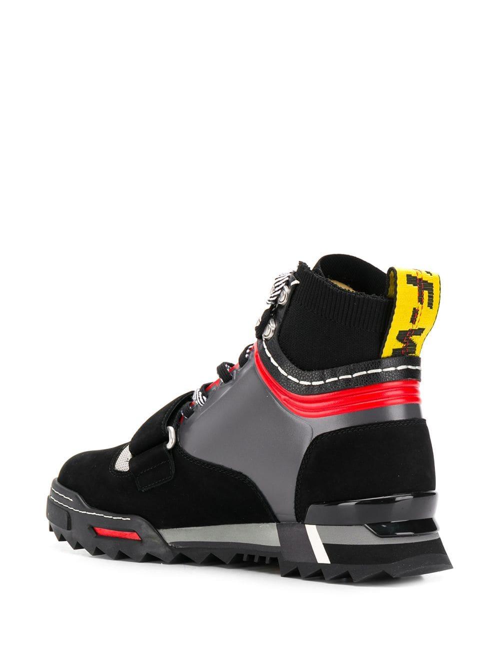 sneakers with arrow logo