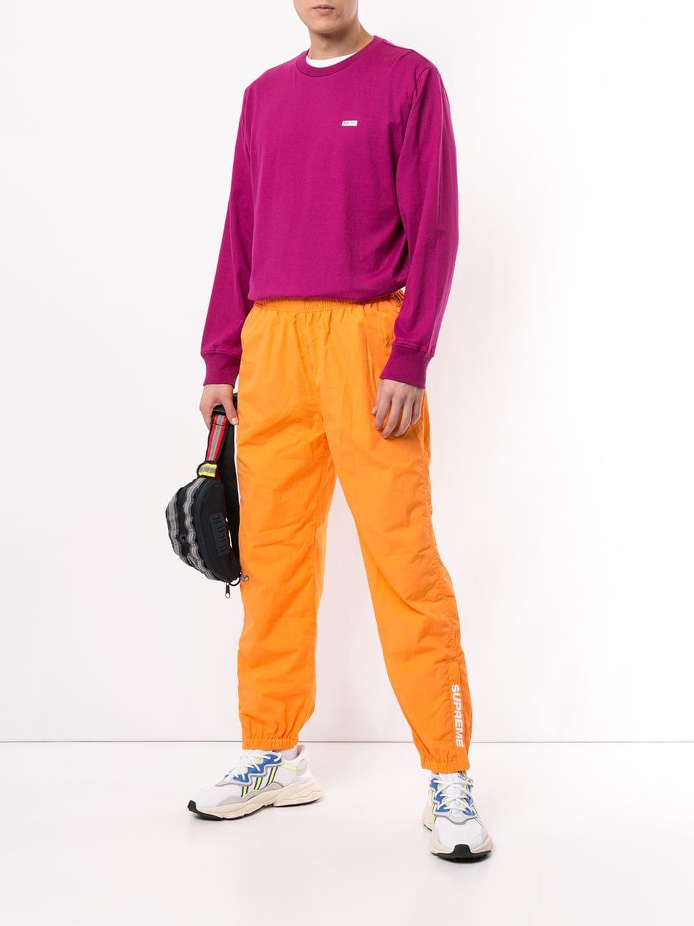 Supreme Warm Up Track Pants in Orange for Men | Lyst