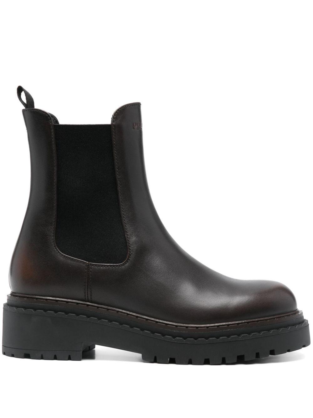 Prada Debossed Logo Calf Leather Ankle Boots in Black Lyst UK