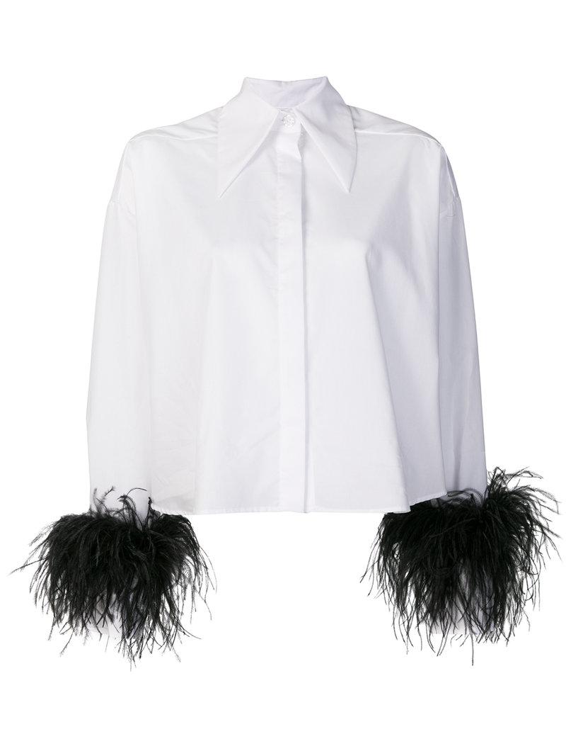 white shirt with feathers