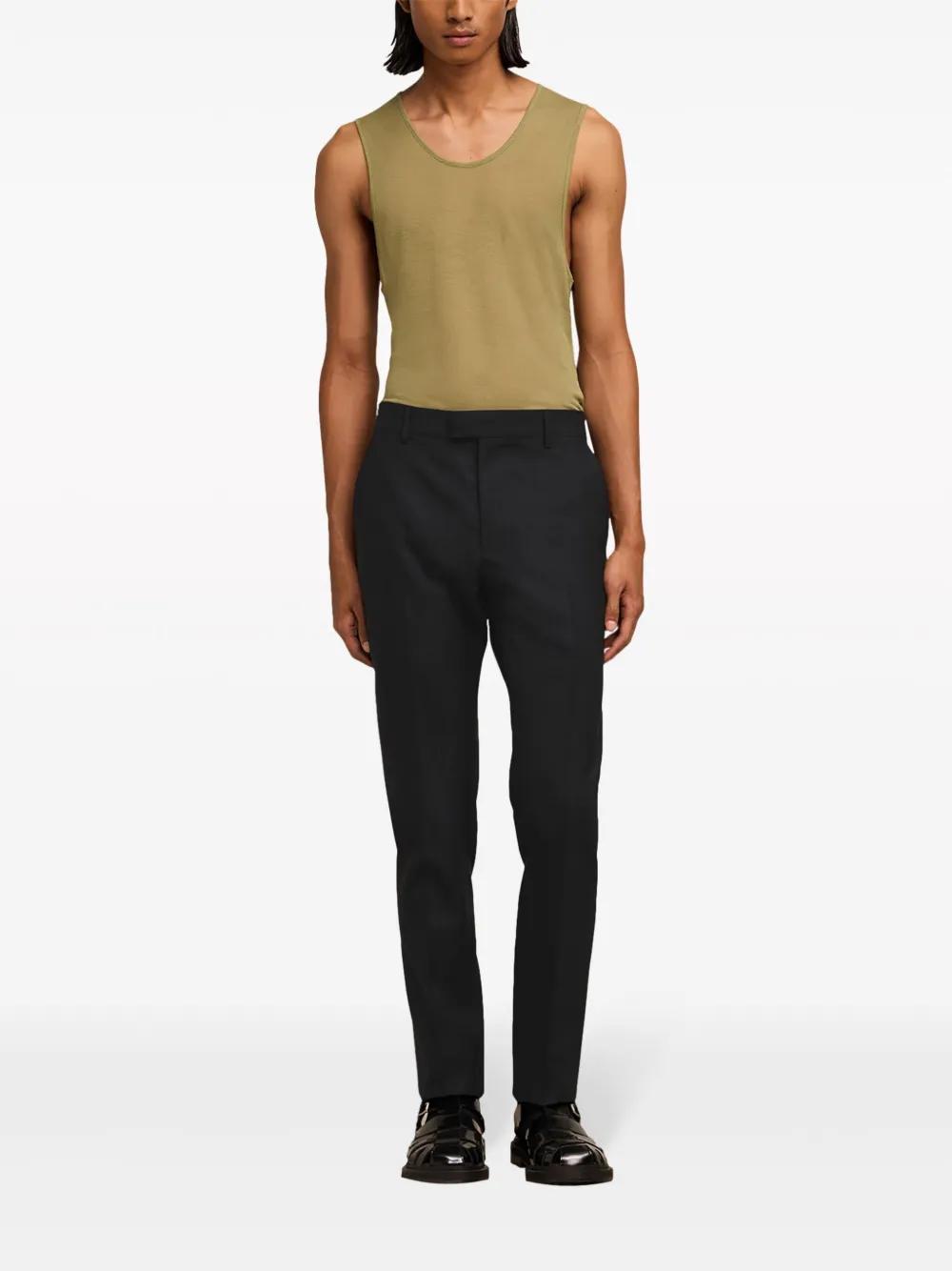 ami cigarette fit trousers Paris Navy stretch twill Pleats at front Embroidered logo at back Rolled cuffs Hidden button with hook Ami Alexandre Mattiussi Cigarette Fit