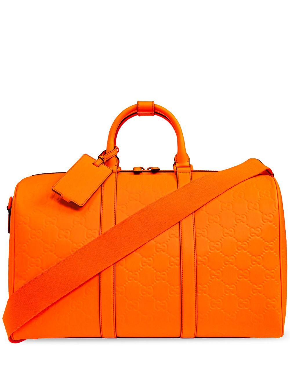 Gucci Medium Gg Rubber-Effect Duffle Bag in Orange for Men