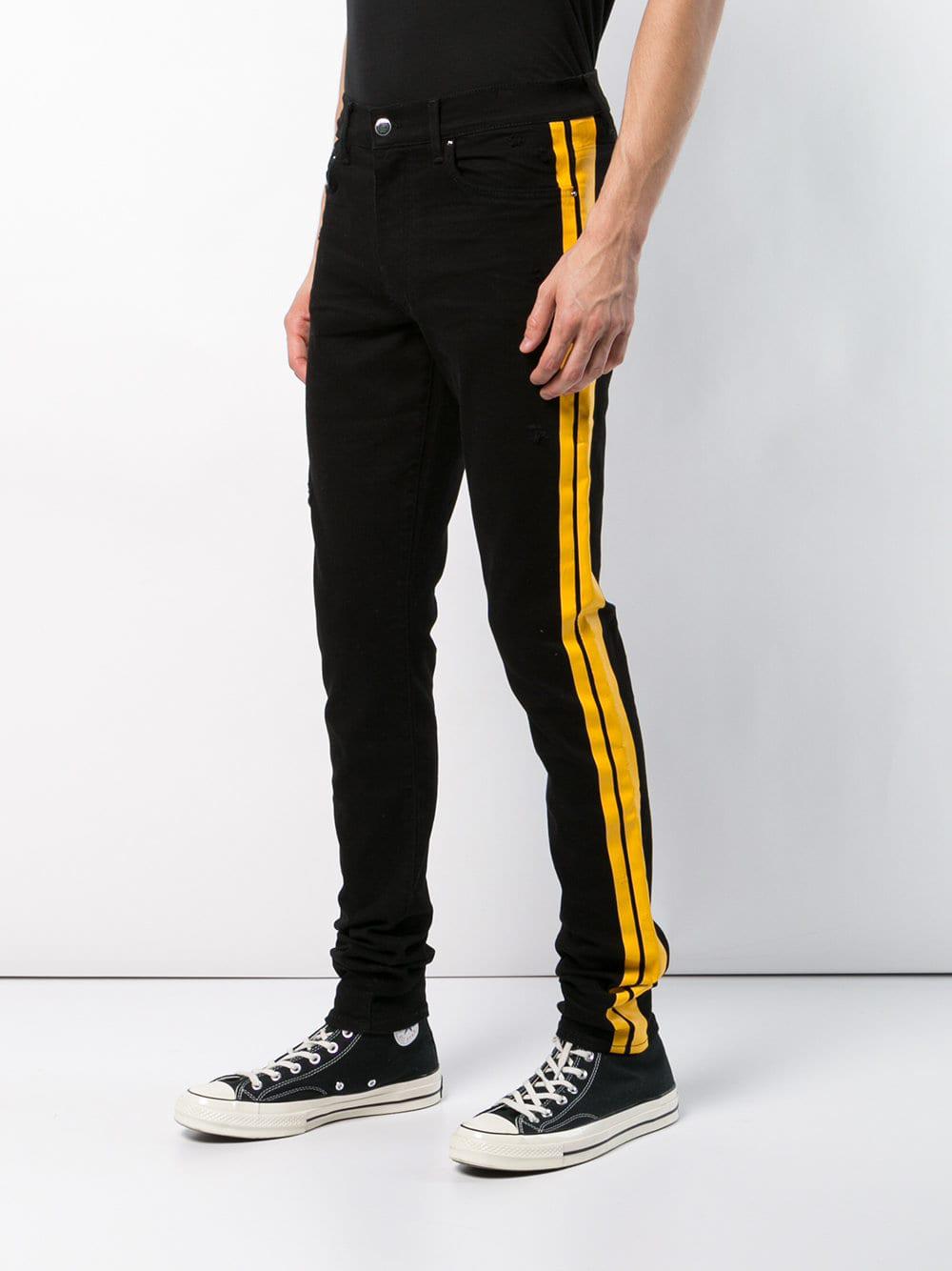 black and yellow amiri jeans
