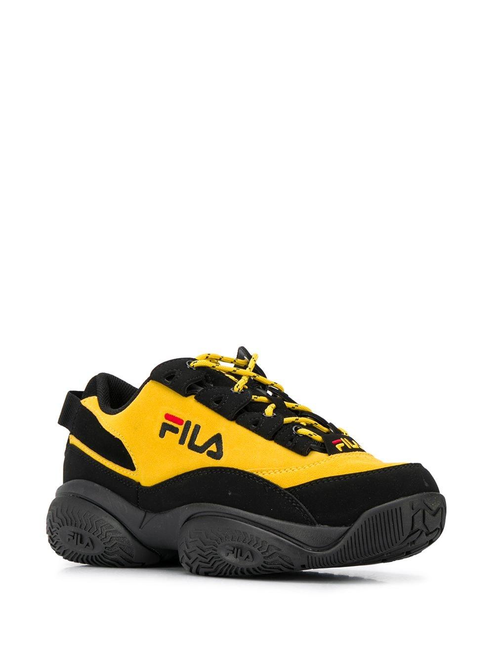 fila black and yellow sneakers