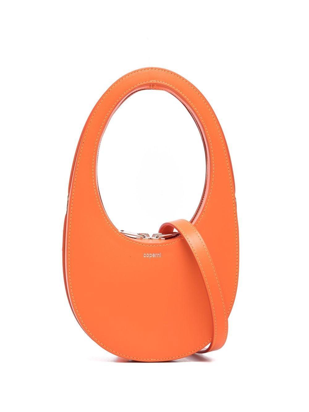 Coperni oval shaped design tote bag in orange lyst