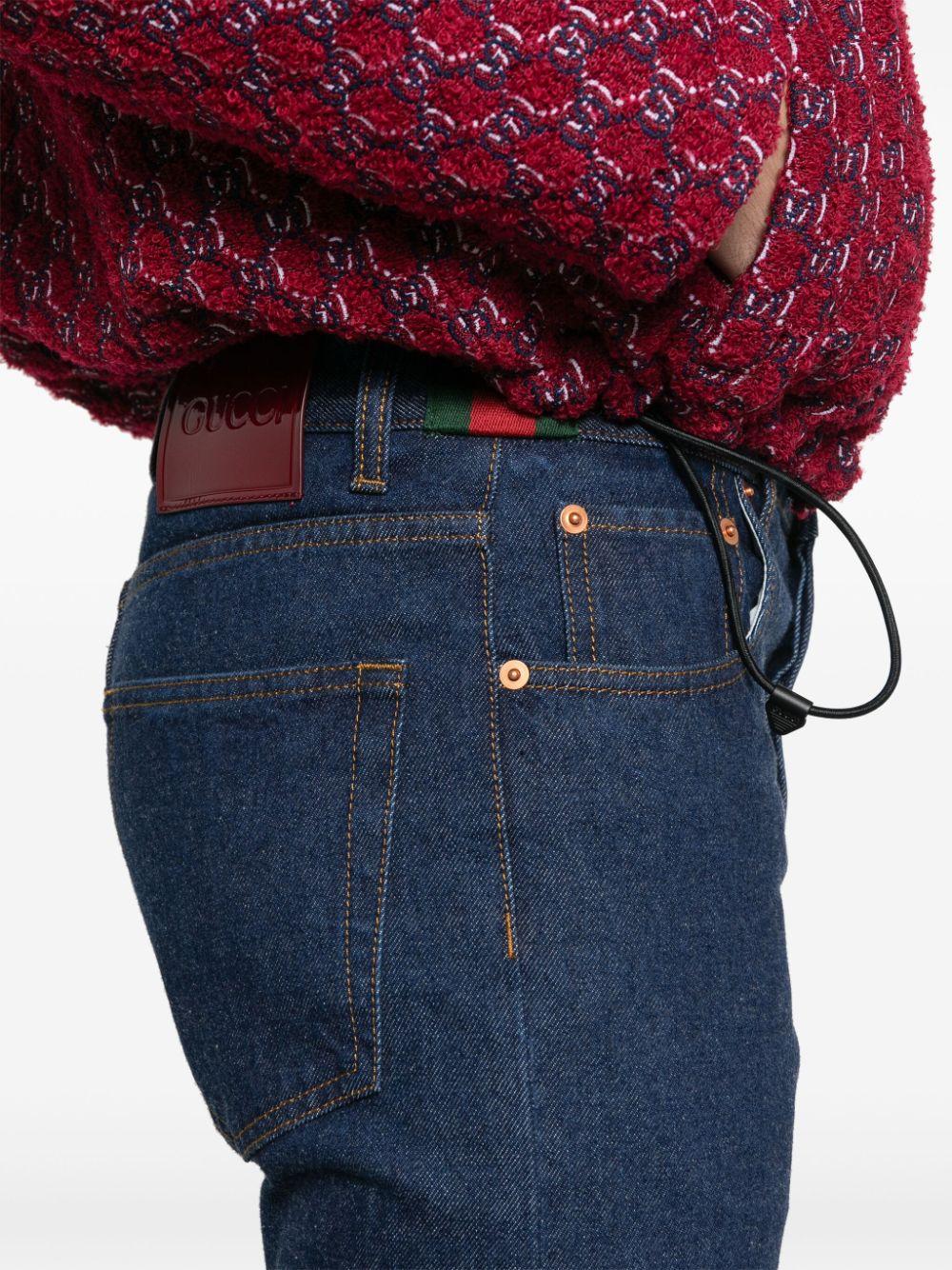 Gucci jeans with red stripe deals