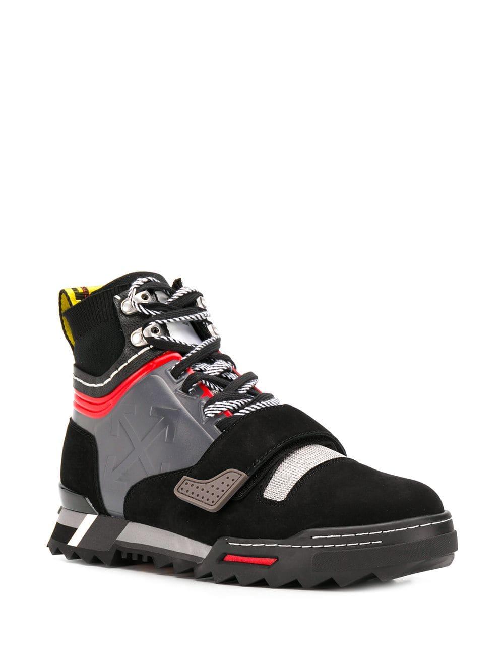 sneakers with arrow logo