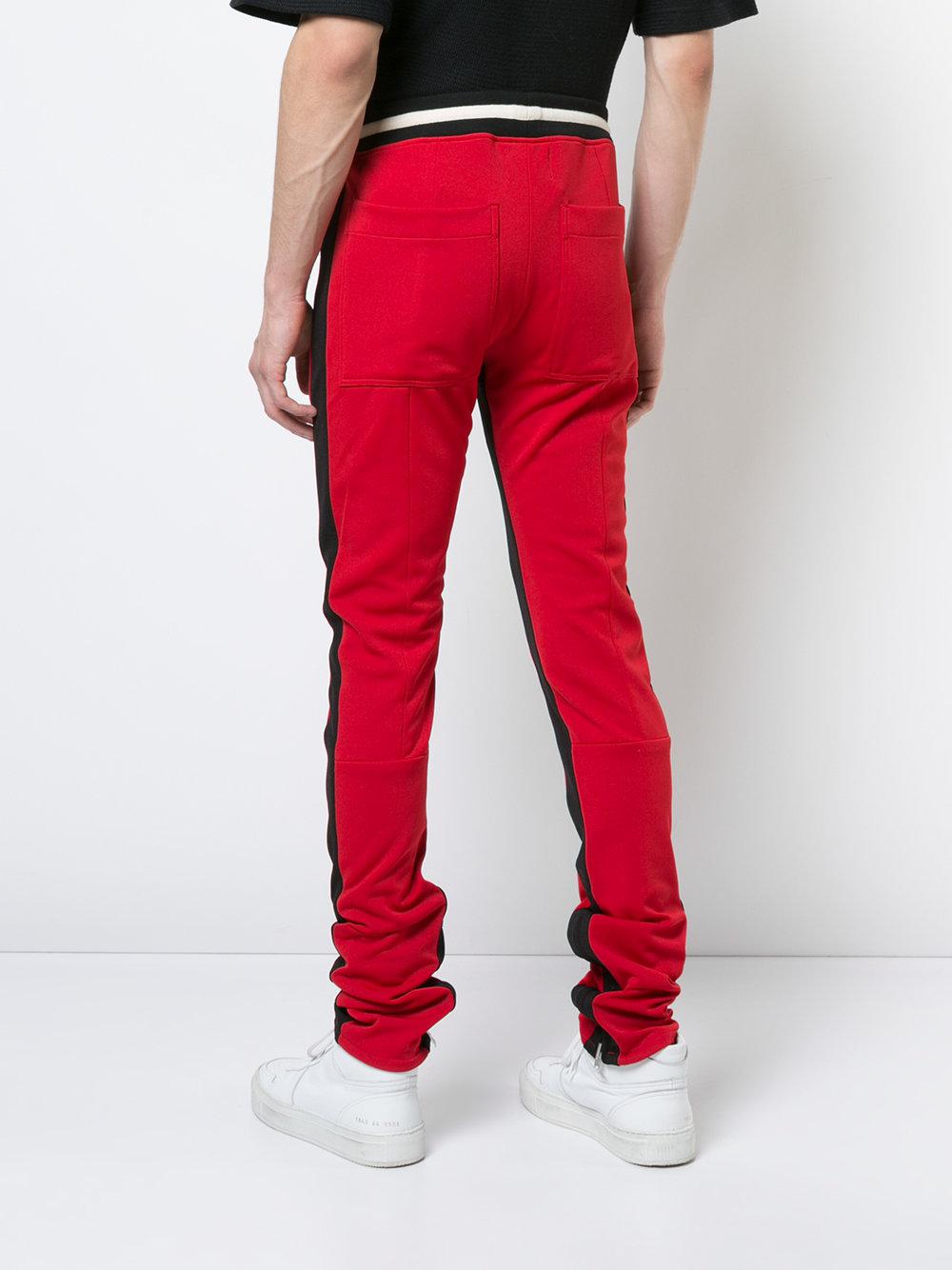 green with red stripe track pants