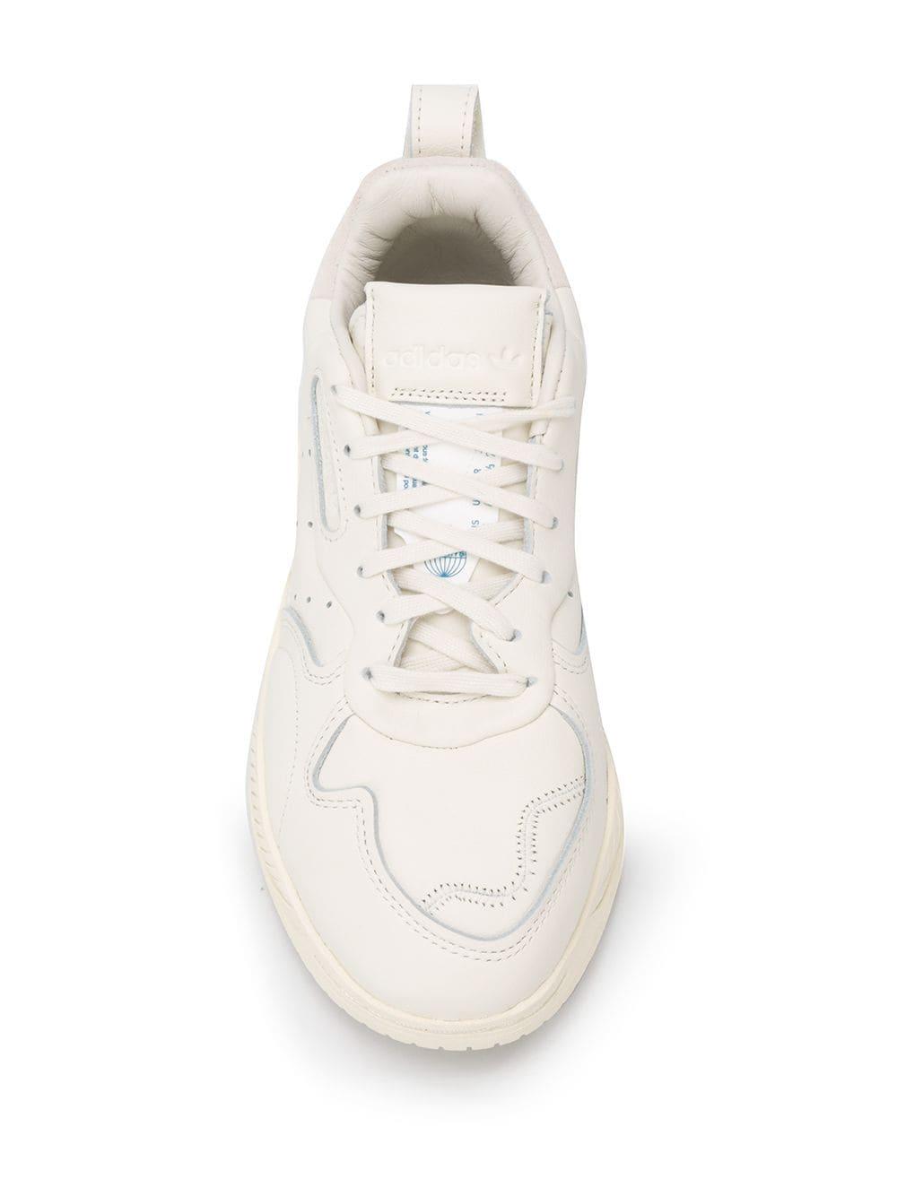 chunky white adidas sneakers