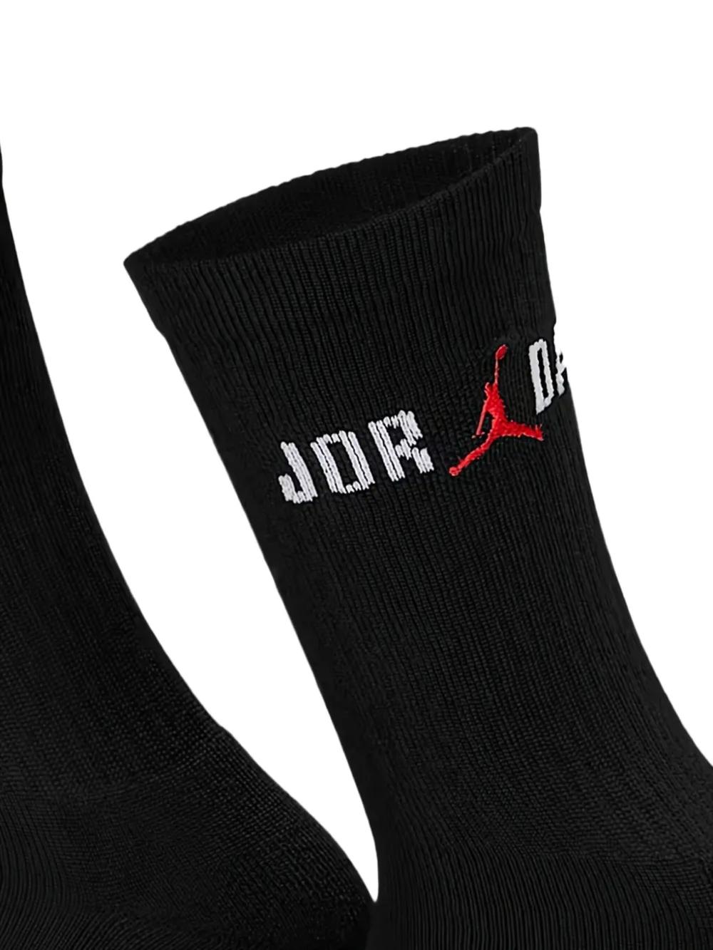 black nike socks with red swoosh