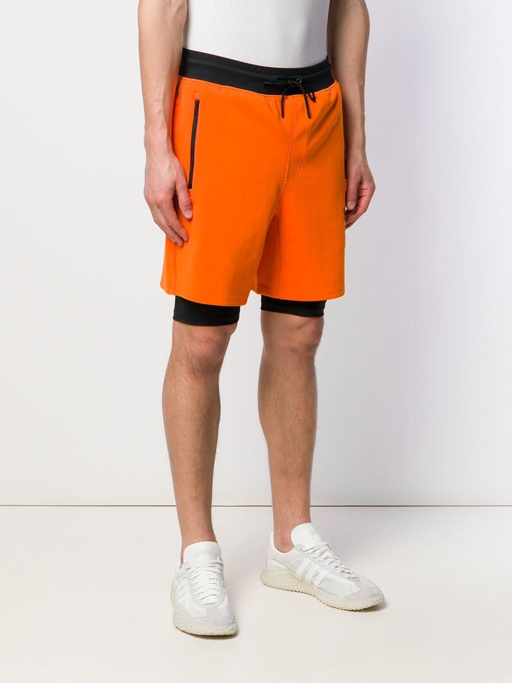 Retirado Refinería Galaxia Palm Angels X Under Armour Shorts in Orange for Men | Lyst
