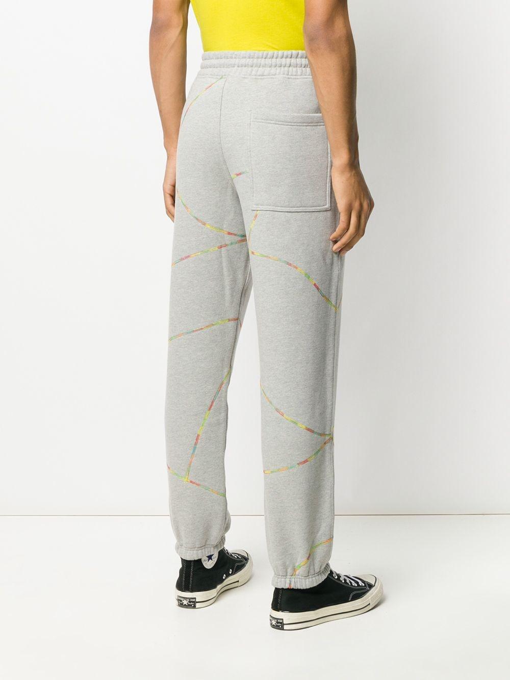 guys in grey track pants