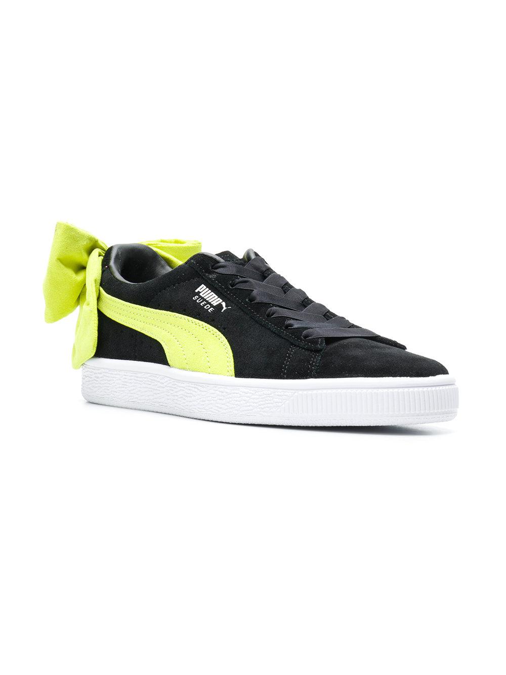 black puma trainers with bow
