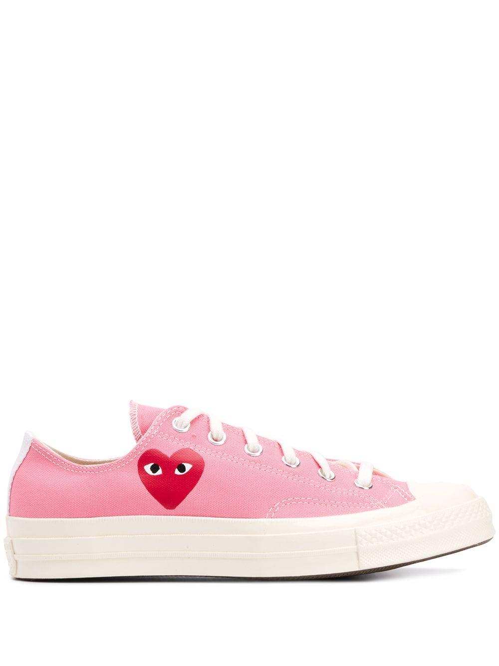 pink high top converse comme des garcons