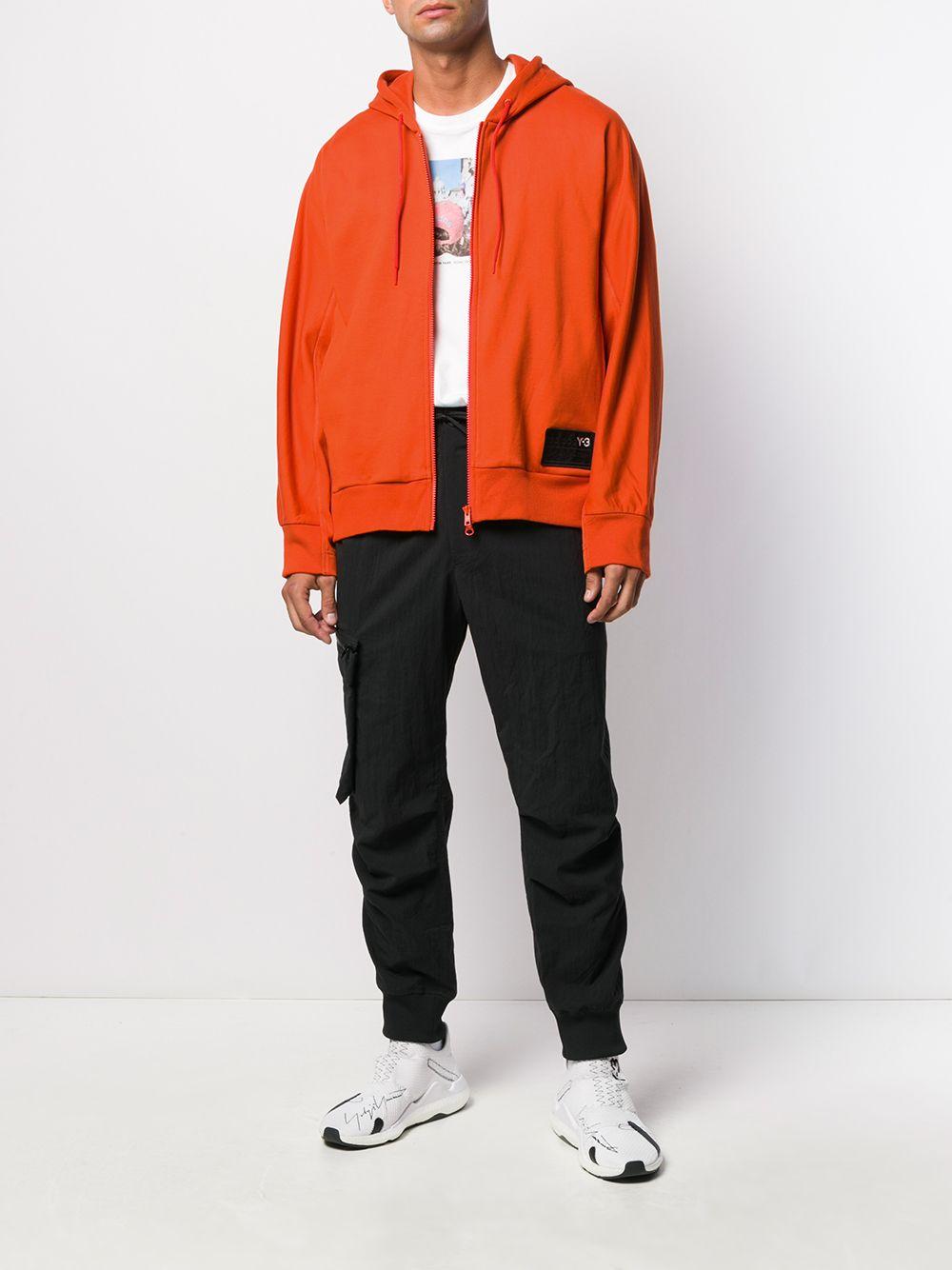 orange zip up jacket