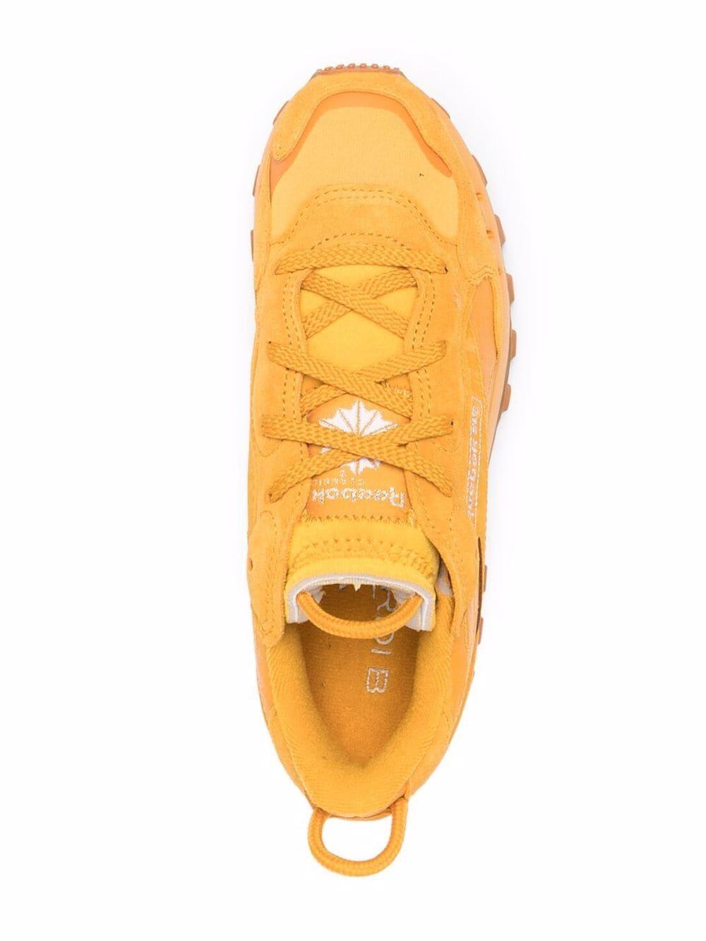 cardi b yellow sneakers