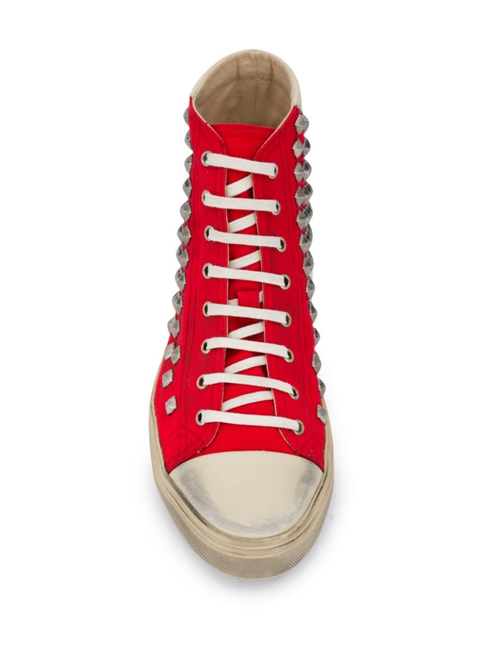 red studded sneakers