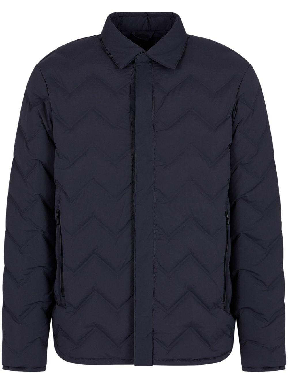 Water-repellent quilted down jacket in light wool with sailing patch