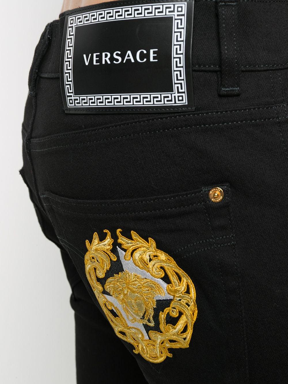 Versace Embroidered Slim-fit Jeans in Black for | Lyst